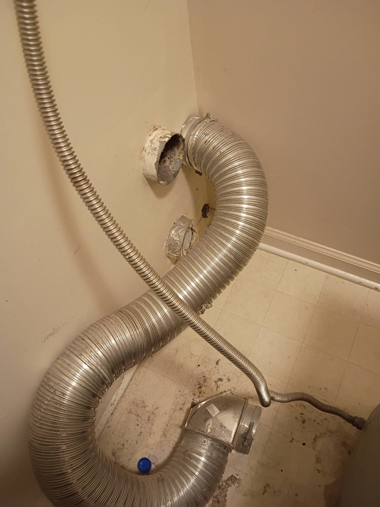 Corroded wall vent opening with disconnected flexible ductwork