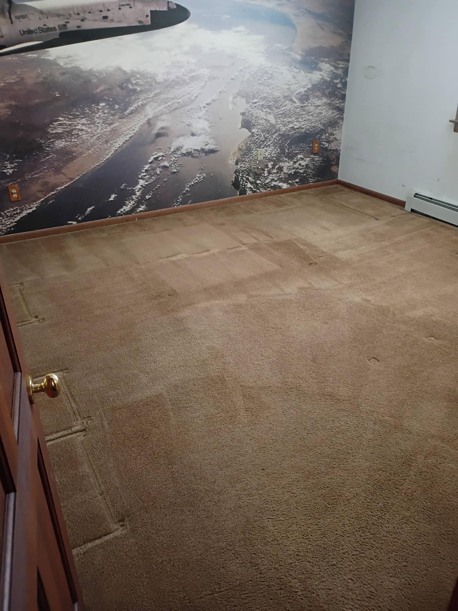 Kid's bedroom with space mural and clean brown carpet after cleaning