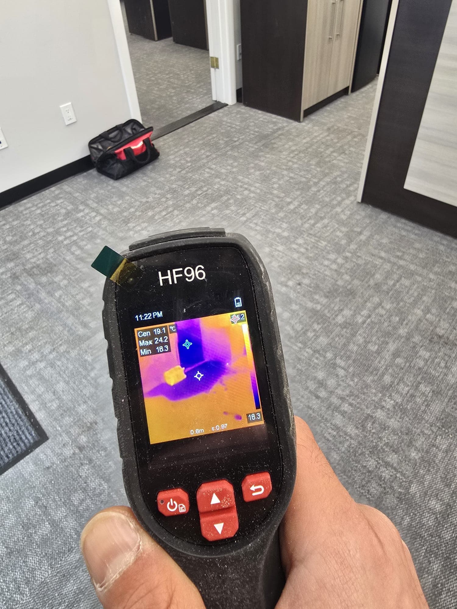 Thermal imaging camera showing a cold wet patch hidden under office carpet